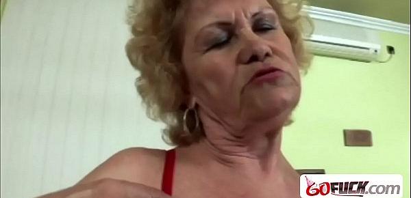  Grandmother enjoys touching her big tits while sucking cock